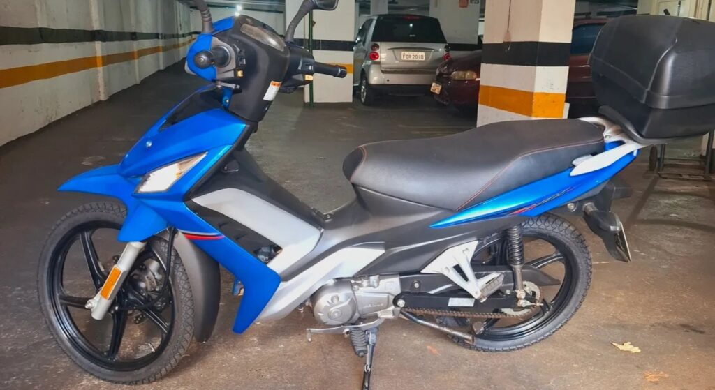 Haojue Nex 110 azul de lado.