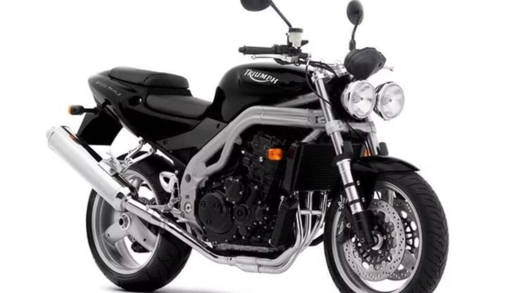 TRIUMPH SPEED TRIPLE 2004 preta na diagonal no fundo branco.